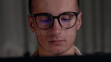 Close Up Focused Face Of Programmer In Computer Glasses With Monitors Reflection Works Online