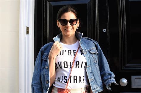 Premium Photo Portrait Of Smiling Woman Standing Against Door