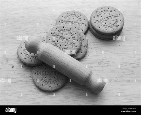 Starting To Crush Digestive Biscuits With A Rolling Pin On A Wooden