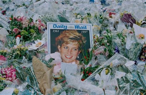 Flowers And Mourners Outside Kensington Palace In The Days Following