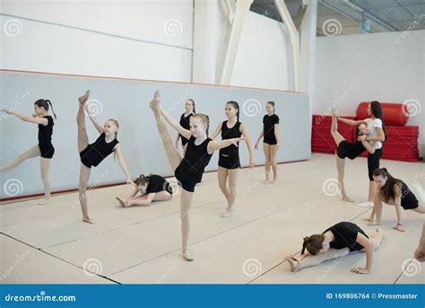 Doing Stretching Exercises At Cheerleading Training Stock Photo Image