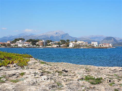 White Concrete Buildings Near Body Of Water During Daytime Free Photos Uihere