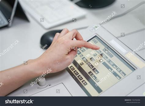 Radiologist Female Hand Operating Fluoroscopy Machine Stock Photo