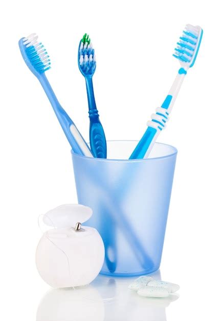 Premium Photo Toothbrushes Chewing Gum And Dental Floss Isolated On White