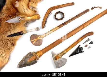 Stone Age Tools on white Background - Stone Age Axe, Knives and Arrows Stock Photo - Alamy