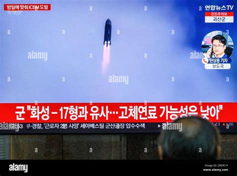 A Tv Screen Shows A File Footage Of North Koreas Long Range Ballistic