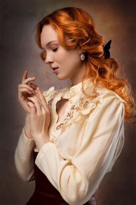 Portrait Of A Red Haired Woman In A Skirt Blouse And Corset Stock