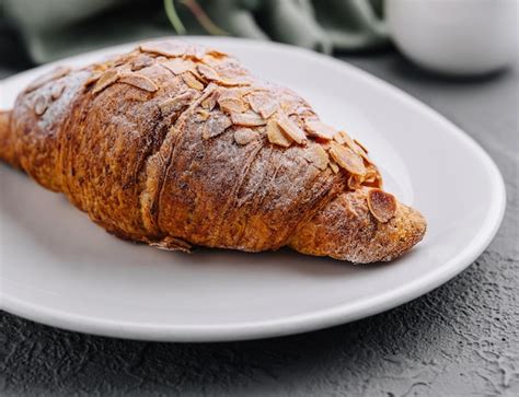 Premium Photo Almond Croissant On Plate Close Up