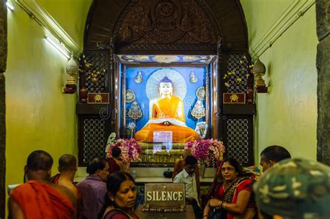 Indian Buddhist Monk And People Standing And Praying On Bare Foot In