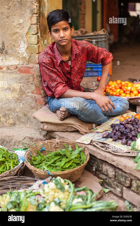 Boy Selling Vegetables At A Market Varanasi India Stock Photo Alamy