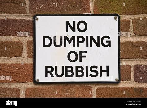 Street Sign No Dumping Of Rubbish Fixed To Wall In Exeter Devon Stock