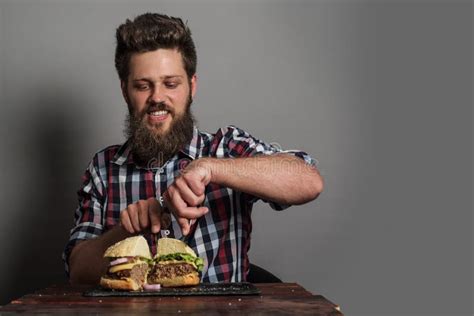 Man eating burger stock image. Image of beef, bearded - 120793075