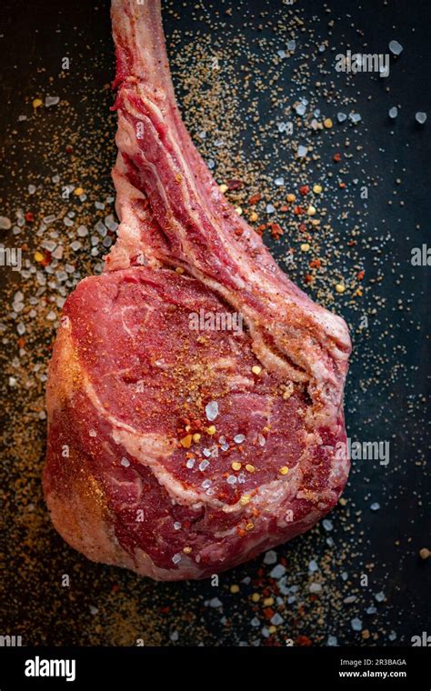 Tomahawk Steak With Spices Stock Photo Alamy