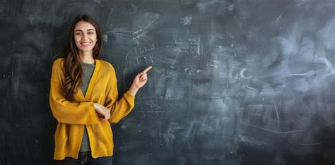 Cheerful Teacher Pointing To Chalkboard On Teachers Day Premium Ai