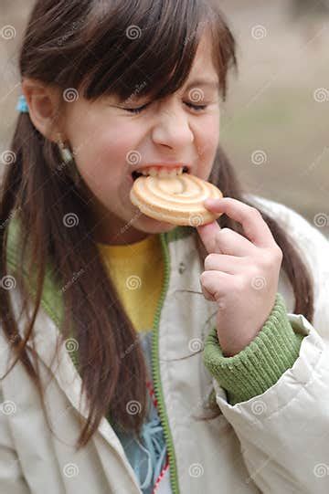 Girl Biting Into Cookie Stock Image Image Of Collar Brunette 4581081