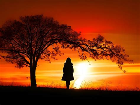 Silhouette of a lonely woman stands alone 30761436 Stock Photo at Vecteezy