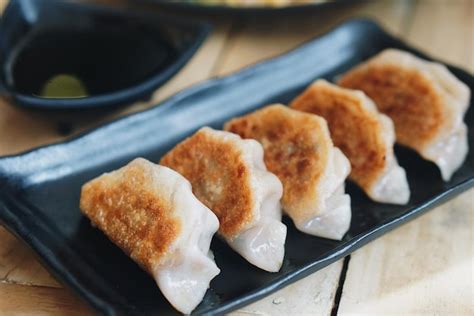 Premium Photo Close Up Of Dumplings In Plate On Table