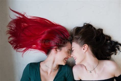 Top View Of Two Women Lying Side By Side Lesbian Intimacy Stock Photo