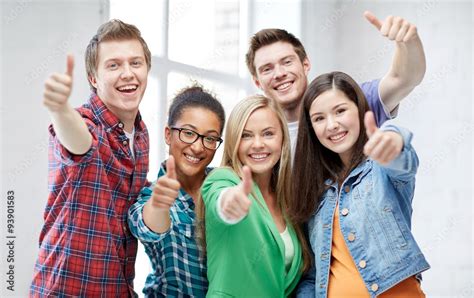 Group Of Happy Students Showing Thumbs Up Stock Foto Adobe Stock