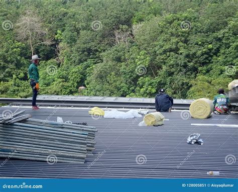 Installation of Metal Deck Roof Sheet by Construction Workers ...