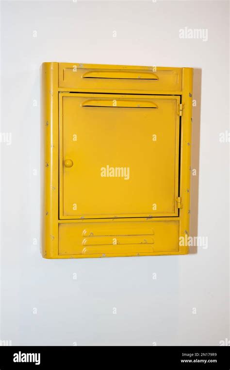 Close Up Photo Of Vintage Yellow Mail Box With Empty Sign Stock Photo