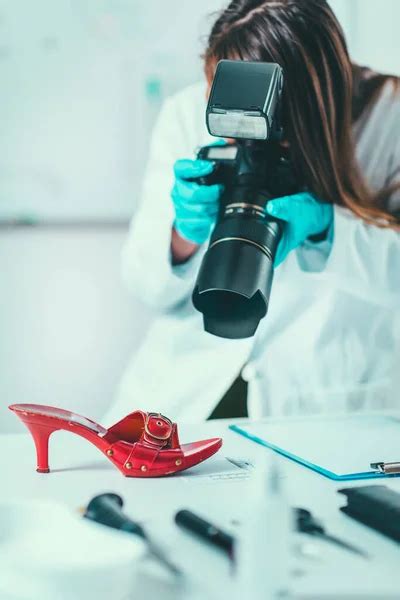 Forensic Science Lab Forensic Scientist Examining Handcuff Evidences