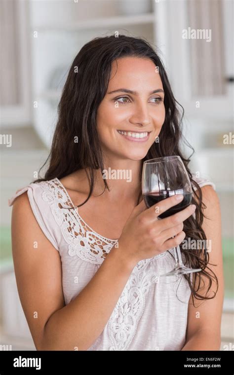 Pretty Brunette Having A Glass Of Wine Stock Photo Alamy