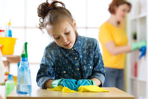 Mother And Daughter Cleaning In Living Room Stock Image Image Of Help