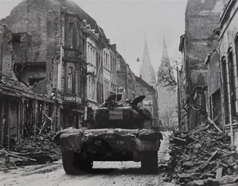 The M26 Pershing Of The 3rd Armored Division Moving Down A Street In