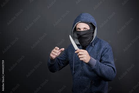 American Hooded Man With Black Mask Holding Knife And Hand Reaching