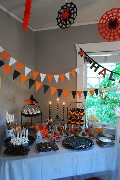 A Table Topped With Cakes And Cupcakes Next To A Cake Stand Filled With