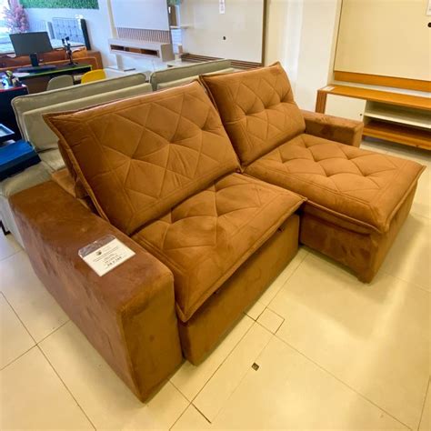 A Brown Couch Sitting On Top Of A White Tiled Floor