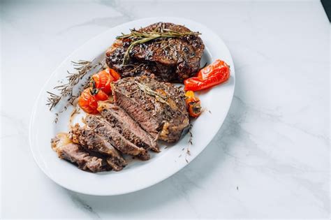 Premium Photo Juicy Wellfried Ribeye Steaks On A White Platter On A