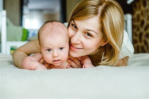 Portrait Of Happy Mother And Baby At Home Stock Photo Image Of