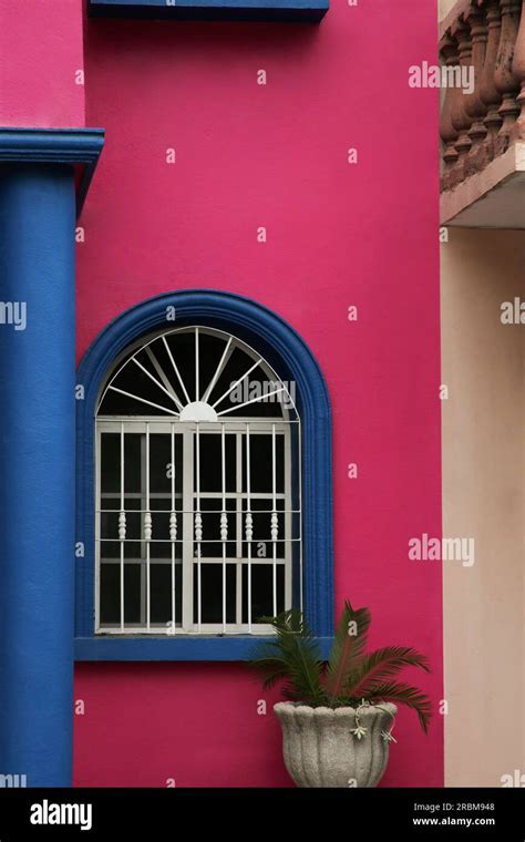 Colorful Building With Beautiful Window And Steel Grilles Outdoors