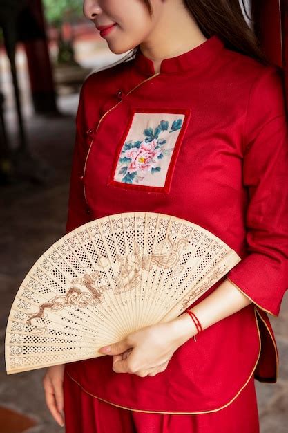 Premium Photo Midsection Of Woman Holding Red Umbrella