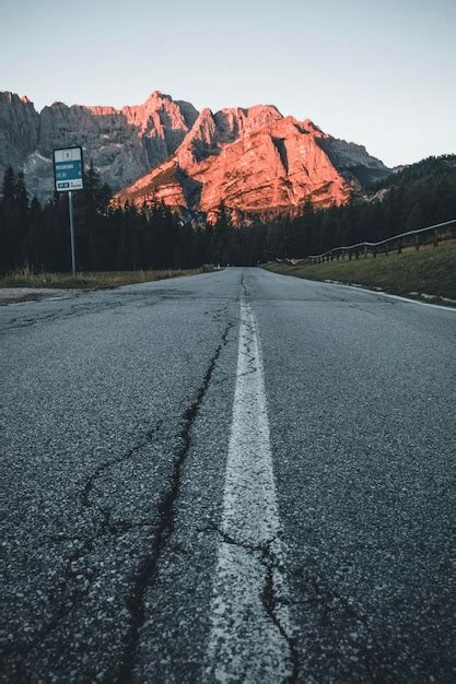 Premium Photo Surface Level Of Empty Road Against Mountain Range