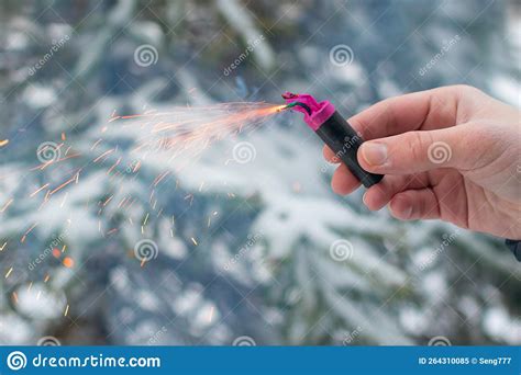 Burning Firecracker In A Hand Sparks And Smoke Of Petard Stock Image