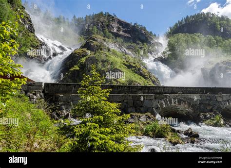 The Twin Falls Latefossen Waterfall With White Water Thundering Down