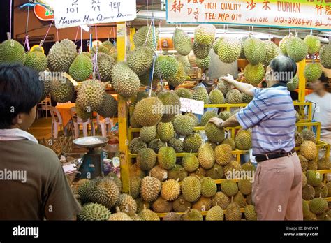 Man Selling Durians At A Fruit Stall In Kuala Lumpur Malaysia Stock