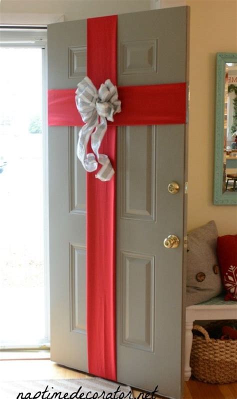 A Door Decorated With Red Ribbon And A Bow