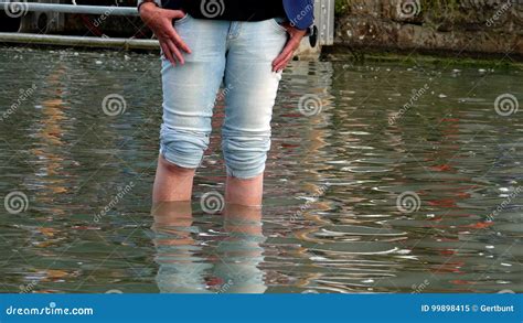 Woman Wading Through Water Stock Image Image Of Overflow 99898415