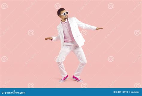 Cheerful Cool Young Man in Suit Shows Funny Dance Moves Isolated on Pink Background. Stock Image ...