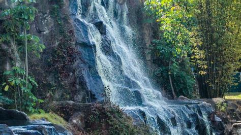 Wide Wall With Waterfall In A Public Nature Park On A Sunny Day Stock