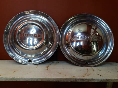 Two Vintage Chrome Dodge Hubcaps