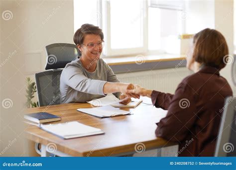 Smiling Hr Manager Interviewing Candidate In Meeting Stock Photo