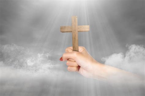 Premium Photo Human Hand Holding Christian Cross