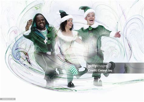 Three Christmas Elves Dancing In Line Laughing And Cheering Portrait