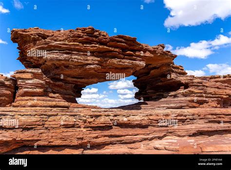 A Window Shaped Archway Cut Into A Sandstone Rock Formation In Kalbarri