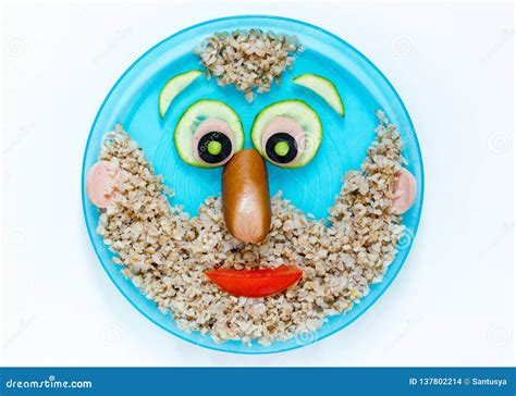 Buckwheat Porridge Shaped Funny Man Face On Plate Isolated Stock Photo